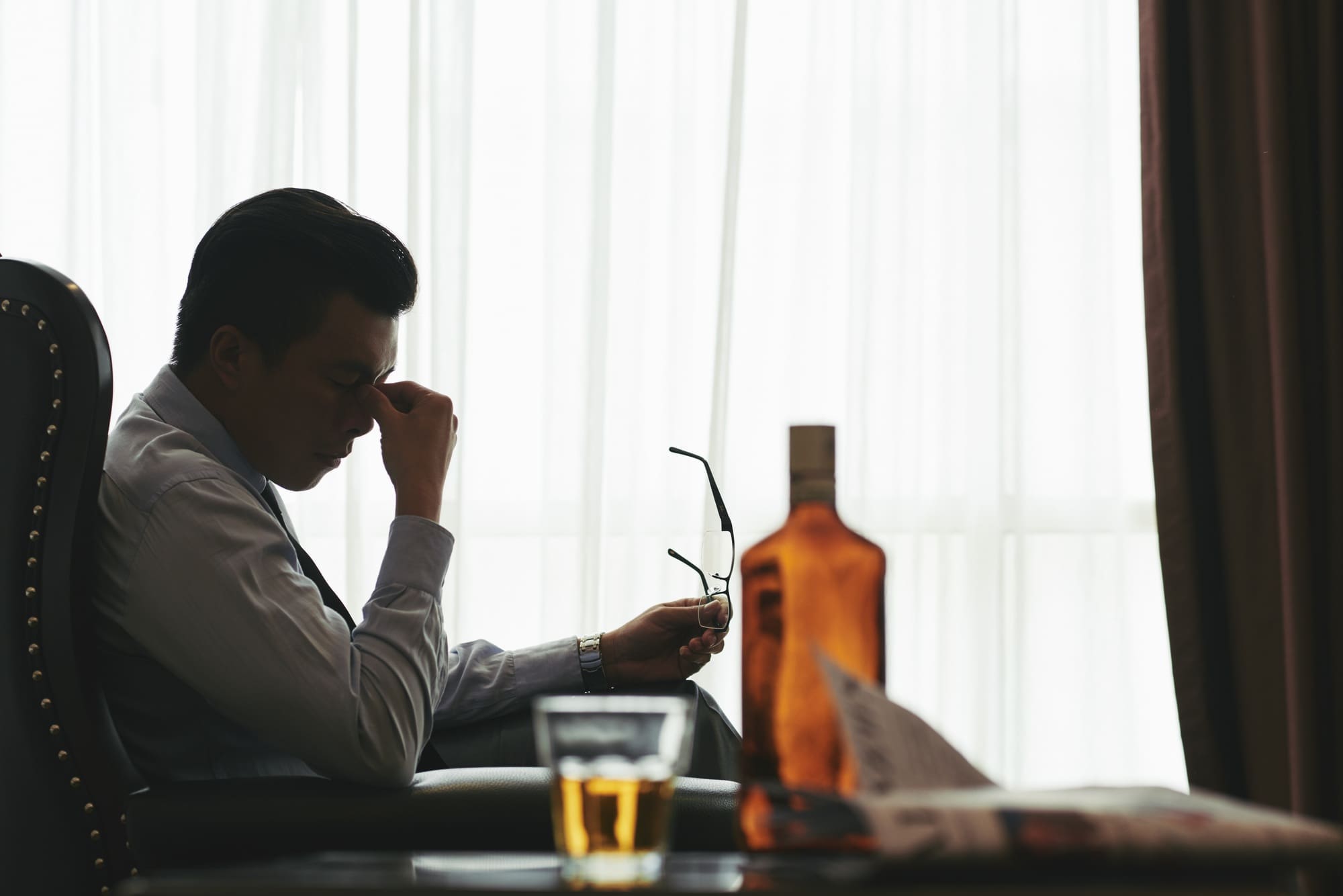 alcohol abuse disorder header with a sad man unable to stop drinking