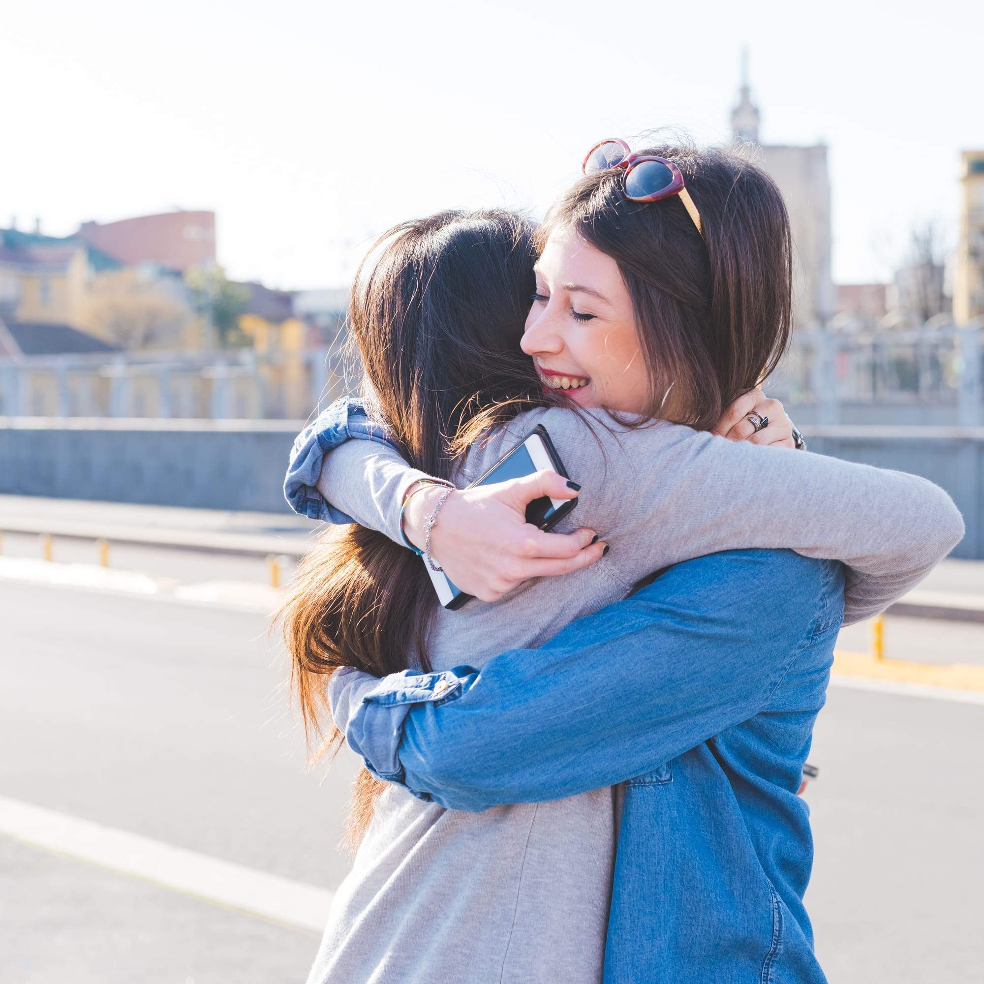 Two women friends hugging